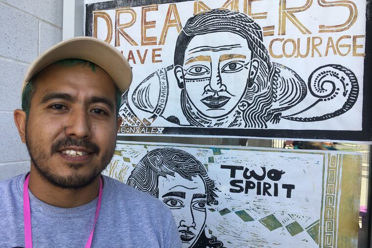 Artist Nicolas Gonzalez-Medina, who is undocumented - and unafraid - with some of his artworks. He participated in the Familia: Trans Queer Liberation Movement conference in the city's Fairhill section on Saturday.