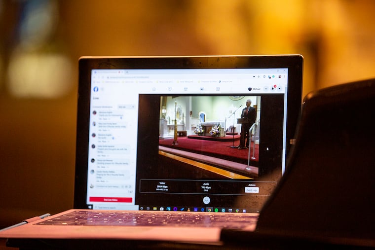 A Facebook live stream records the funeral at St. Margaret Church for families and friends who were unable to make it due to the coronavirus outbreak on Thursday, March 19, 2020.