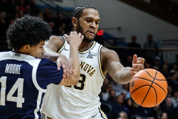 Villanova's Eric Dixon, right, seen here in action against Butler, scored a team-high 22 points in the Wildcats rout of Georgetown on Tuesday night.