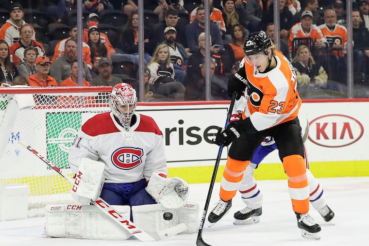 Oskar Lindblom (23), here battling in front of Canadiens goaltender Carey Price, is one of the young Flyers who have stepped up.