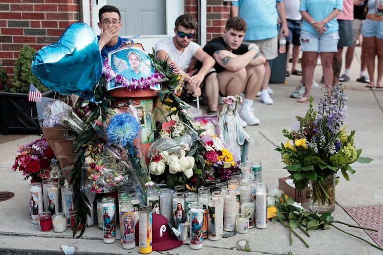 People gather for a vigil in memory of South Philly shooting victim Billy Schmidt on June 11 in South Philadelphia.