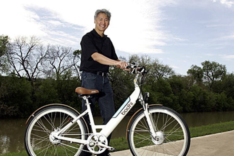 Paul Jung, co-founder/president of Bodhi bicycles, shows off an electric bike in Fort Worth, Texas, March 22, 2011. (Bob Booth/Fort Worth Star-Telegram/MCT)