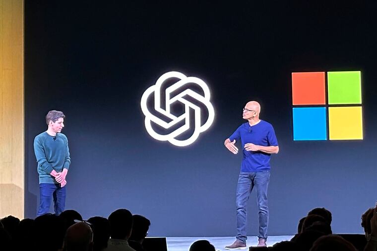 OpenAI CEO Sam Altman (left) appears onstage with Microsoft CEO Satya Nadella at OpenAI's first developer conference in November 2023, in San Francisco. The two companies have formed a new partnership.