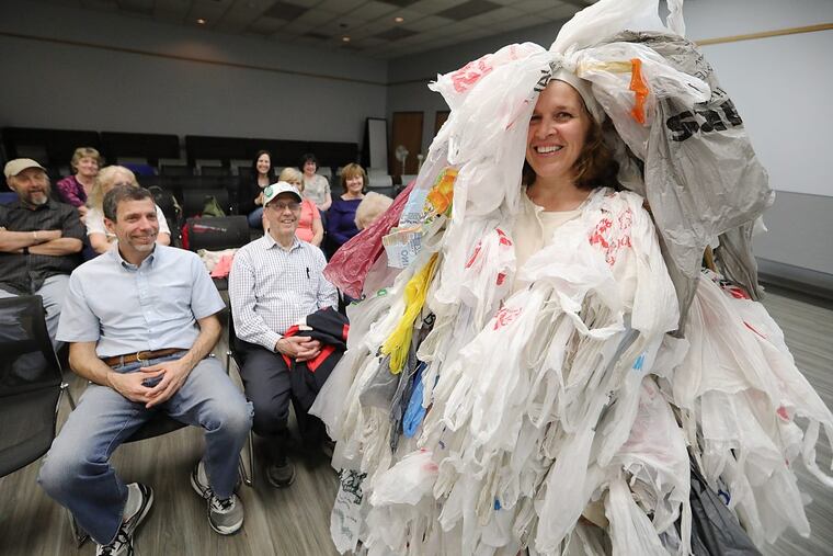 Karen Cohen, an environmental activist from Mount Laurel, utilizes a ‘bag monster’ costume representing the hundreds of bags a typical American adult acquires and disposes of annually. She recently wore the costume to a Mount Laurel Green Team event at the township library.