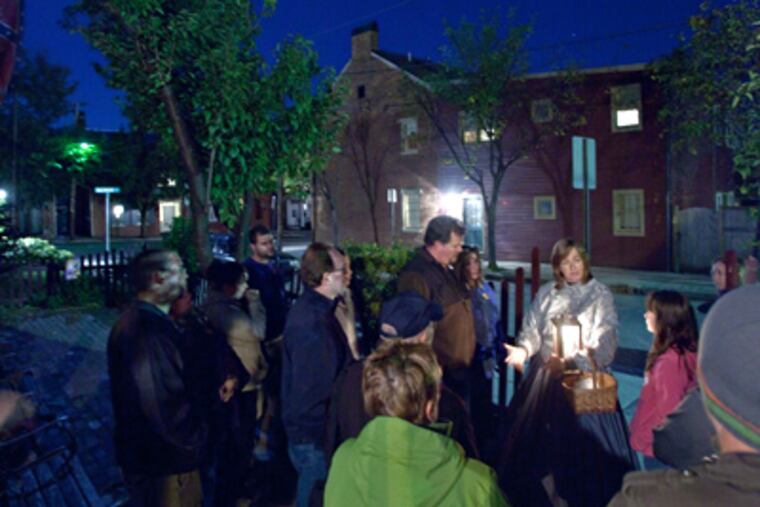 Sandy Kime, in a Civil War-era hoopskirt, begins a Ghosts of Gettysburg tour. (David M Warren / Staff Photographer)