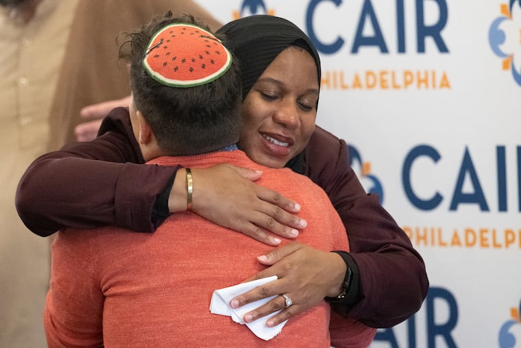 Keziah Ridgeway, (left), embraces with Rabbi Ari Lev Fornari minutes after the announcement on the filing of a federal lawsuit against the School District of Philadelphia on behalf of Keziah Ridgeway, on Thursday, May 15, 2025, at The Friends Center, in Philadelphia.