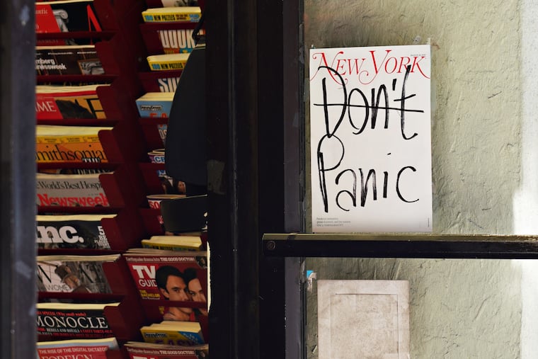 A New York Magazine cover reading "Don't Panic" is displayed on the door of a magazine shop as the coronavirus continues to spread across the United States on March 15, 2020 in New York City.
