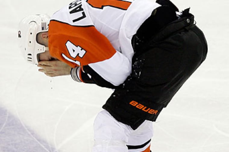 "Right now, it's not safe for Ian to play," Flyers general manager Paul Holmgren said. (Yong Kim/Staff Photographer)
