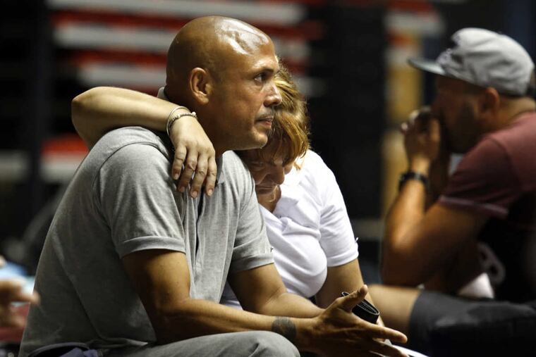 Francisco Santiago Torres (left) and his wife, Suzette Vega Rozas, at the Roberto Clemente Coliseum shelter in San Juan, Puerto Rico.