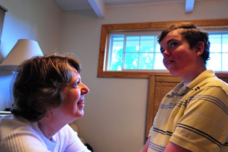 Michael Ferrara (with his mother, Judi), 25, is mentally handicapped and unable to identify his abuser. (Jason Melcher / Staff Photographer)