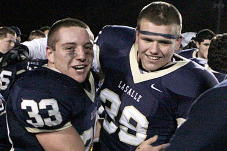La Salle's Tim Wade and Ryan Meeks celebrate after La Salle's title win over Roman Catholic. (Elizabeth Robertson/Staff Photographer)