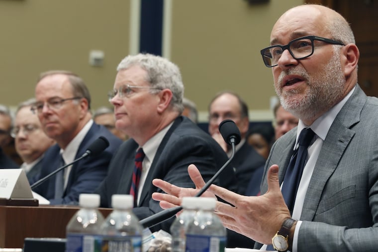 Steven Collis, right, chairman, president, and CEO of AmerisourceBergen Corp., testifies with other distributor executives during a congressional hearing about combating the opioid epidemic, on Capitol Hill, Tuesday, May 8, 2018.