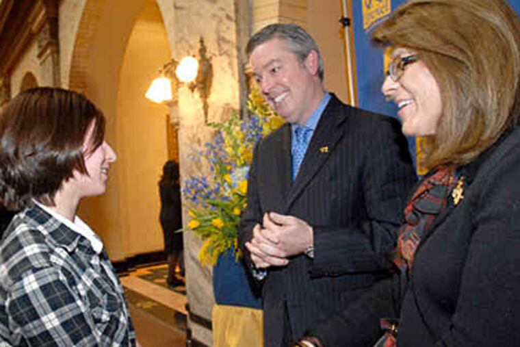 John A. Fry and his wife, Cara, accept congratulations from Drexel student Stephanie Boyle. Among his goals: more living space on campus, closer ties to Penn, a better gateway to Center City and an expansion of the Drexel network. (April Saul / Staff)