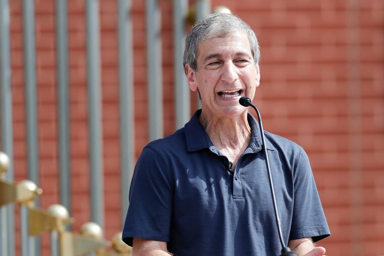 Filmmaker Mike Tollin talks about former Phillie Dick Allen during a ceremony for Allen before the Phillies-Nationals game on Thursday. The Phillies retired Allen's No. 15.
