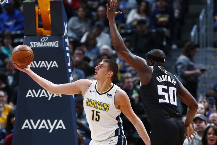 Nikola Jokic (left) and his Denver Nuggets teammates have won 14 of 22 games since Feb. 1.