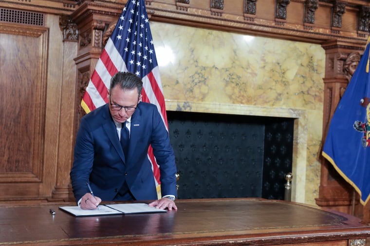 Gov. Josh Shapiro signs an executive order restricting data centers in Pennsylvania during an Aug. 18 ceremony in the Capitol. The directive gives local governments more control over data centers, but it also creates the potential for a patchwork system, writes the Editorial Board.