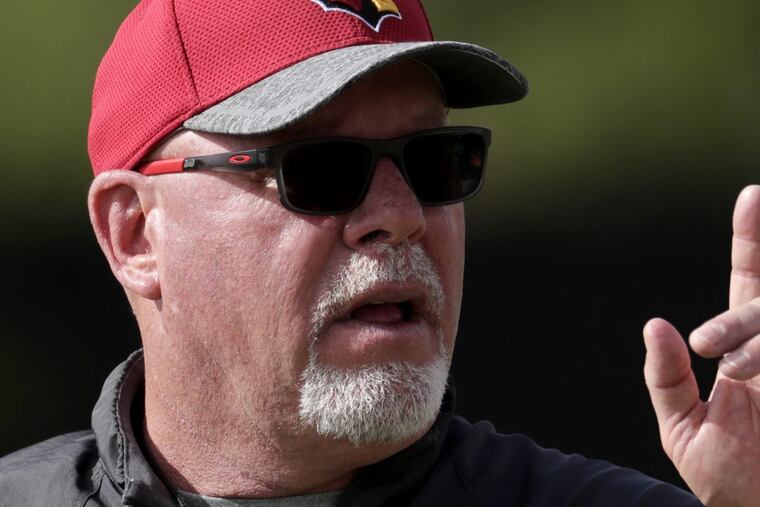 Arizona Cardinals head coach Bruce Arians signals his players during a voluntary team workout, Tuesday, May 16, 2017, in Tempe, Ariz. (AP Photo/Matt York)