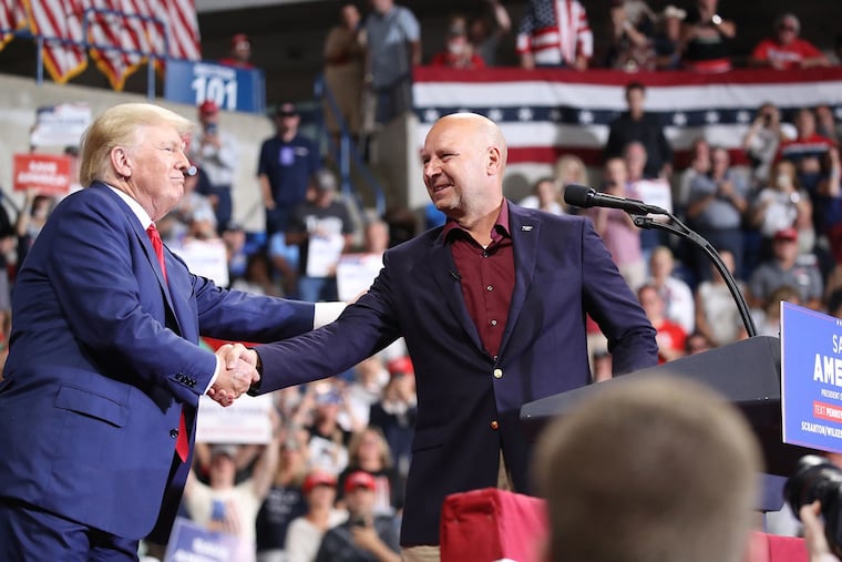 Doug Mastriano is greeted by Donald Trump at a 2022 rally in Wilkes-Barre during Mastriano's unsuccessful campaign for governor.
