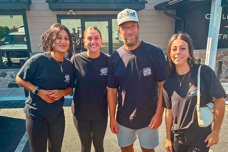Barstool Sports founder Dave Portnoy with Italian Delite employees (from left) Loula, Olivia, and Vivanna on Aug. 4, 2026.