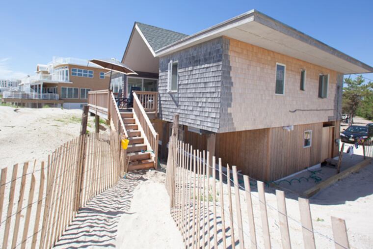 Down North Lane in Loveladies, one of those private, no beach access streets, the beach-front home of Dr. and Dr. Newell Fischer, psychiatrists from Bryn Mawr, was directly in Hurricane Sandy's path. The house sustained a lot of damage primarily to its lower level. New shingles yet to weather, contrast with the original shingles. (Ed Hille / Staff Photographer)