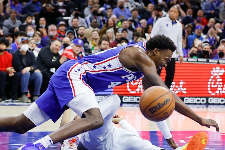 Sixers forward Paul Reed falls down going after the basketball against Oklahoma City Thunder forward Darius Bazley during the second quarter on Friday. Reed missed a dunk on the play.