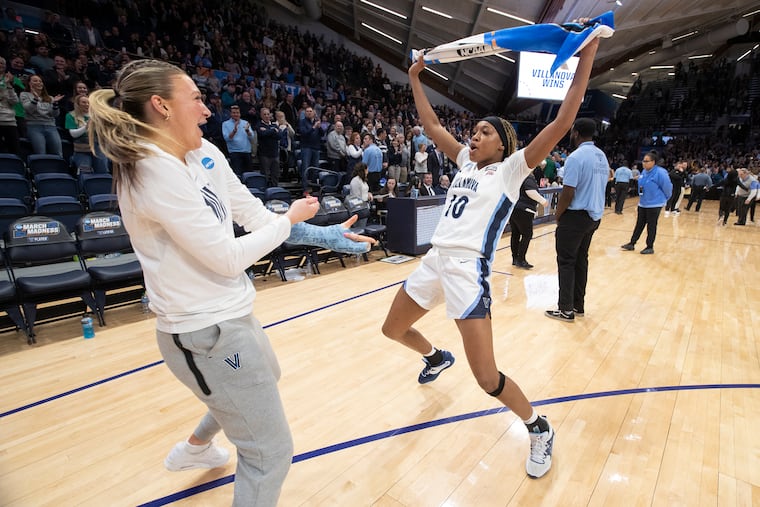 Megan Olbrys (left) and Christina Dalce of Villanova do a victory dance after defeating Florida Gulf Coast.