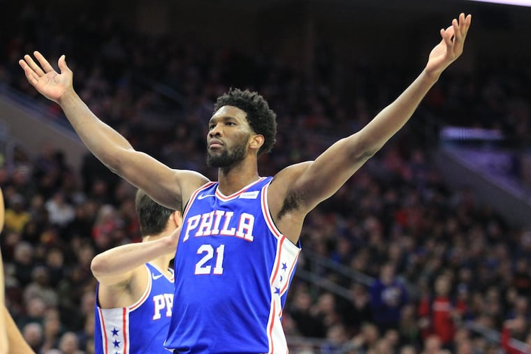 Joel Embiid of the Sixers spreads his arms after a third-quarter dunk against the Spurs during at the Wells Fargo Center on Jan 3, 2018.