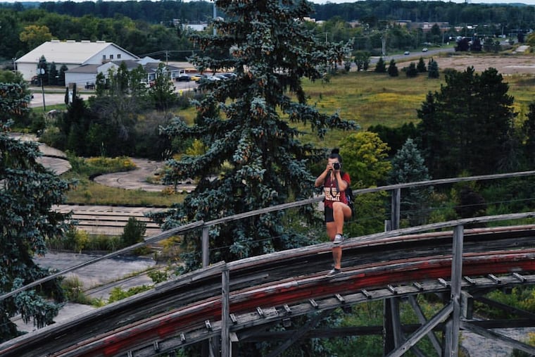 Rebecca Bunting, who was popular in the urban exploration community, takes photos in an abandoned amusement park.