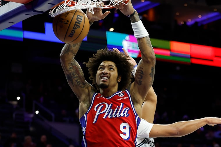 Sixers guard Kelly Oubre Jr., dunks the basketball past Orlando Magic guard Jalen Suggs during the second quarter on Friday, December 6, 2024 in Philadelphia.