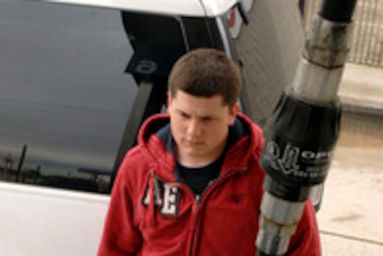 Eric Andracchio of South Phila. pumps $10.10 worth of gas at the Xpress Gas station on Columbus Boulevard.