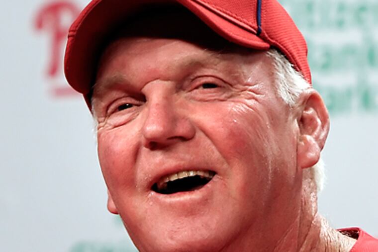 Charlie Manuel talks with the media before Friday's spring training game at Citizen's Bank Park. (Steven M. Falk / Staff Photographer )
