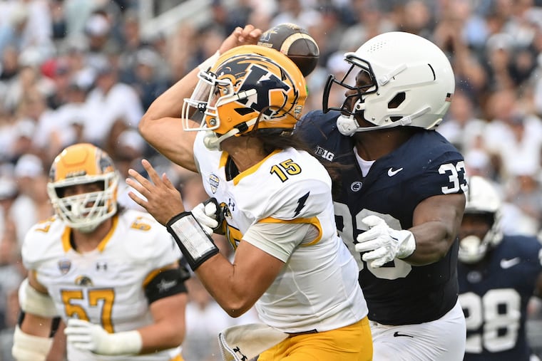 Penn State defensive end Dani Dennis-Sutton tackles Kent State quarterback Devin Kargman during the first quarter Saturday.