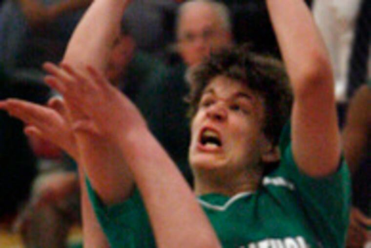 The Irish's Gerry Wixted will not be denied a shot by Holy Spirit's Matt DeSouza. Wixted had 12 points, and DeSouza's 24 led all scorers.