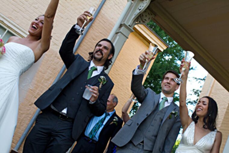 Toasting a double wedding well done: Paris Merin (left), husband Charles Maxey, William Papa, and wife Nina Merin. MICHAEL KOEHLER