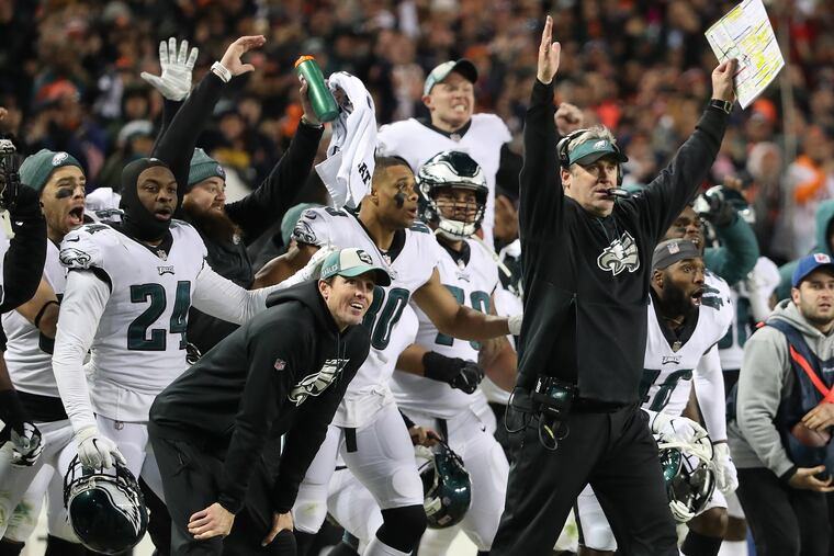 Eagles head coach Doug Pederson, right, celebrates after Chicago Bears kicker Cody Parkey misses a field goal late in the fourth quarter.