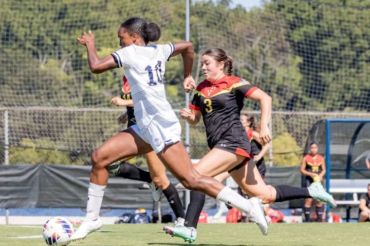 Marlee Heaven (left) leads Navy into Subaru Park for the first matchup between Army and Navy teams along the Chester waterfront.