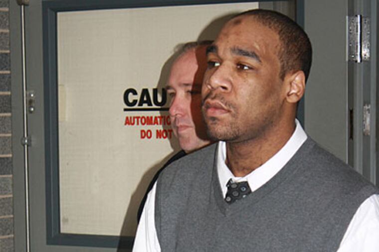 Omar Sharif Cash is led to his trial at the Bucks County Courthouse by sheriff's deputies. (Photo by Larry King)