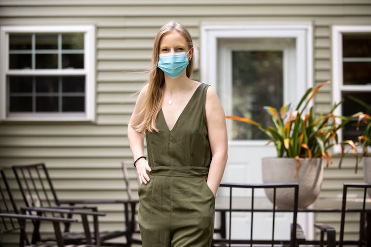 Gabrielle McNary, 25, poses for a portrait outside of her home in West Chester, Pa. McNary has Huntington's disease, a rare genetic neurological disease.