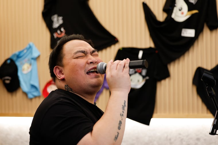 Dim Sum Garden waiter Riyan Pondaga sings on Friday, Feb. 27. Pondaga moonlights as a lounge singer every Friday night during the restaurant's dinner service.