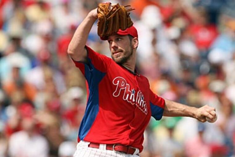 Cliff Lee's return to the Phillies has them as the prohibitive favorites to win the National League. (Yong Kim/Staff Photographer)