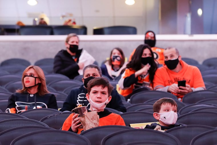 Fans sit in their seats before the Flyers and Washington Capitals game on March 7. The Flyers and Sixers allow 3,100 fans to attend games at the Wells Fargo Center, and that number is expected to increase on April 4.