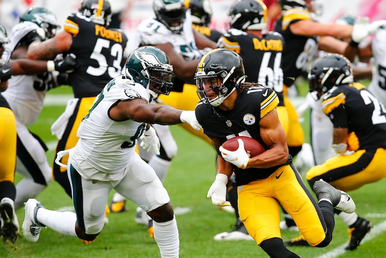 Pittsburgh Steelers wide receiver Chase Claypool runs past Eagles defensive tackle Malik Jackson during the first quarter on Sunday. Claypool scored on a 2-yard touchdown on the run play.