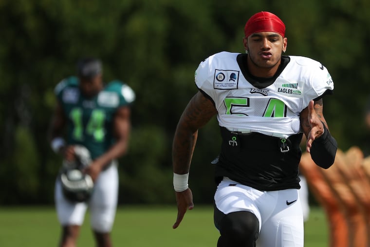Eagles linebacker Shaun Bradley (54) warms up before the start of practice at the NovaCare Complex in South Philadelphia on Friday, Aug. 21. He is among the group of former Temple players in the NFL.
