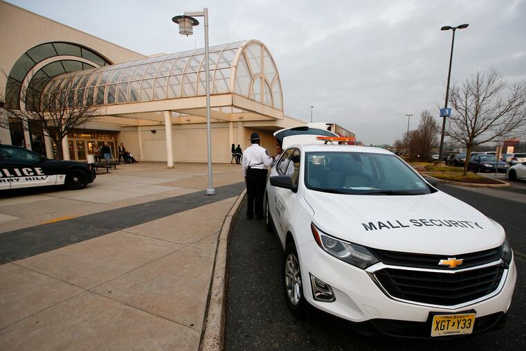 Cherry Hill Mall security members patrol the outside of the mall area on Thursday, December 26. Teens in the past have been known to cause mayhem after Christmas and this year they have to be accompanied by an adult from 4 to 9 p.m.