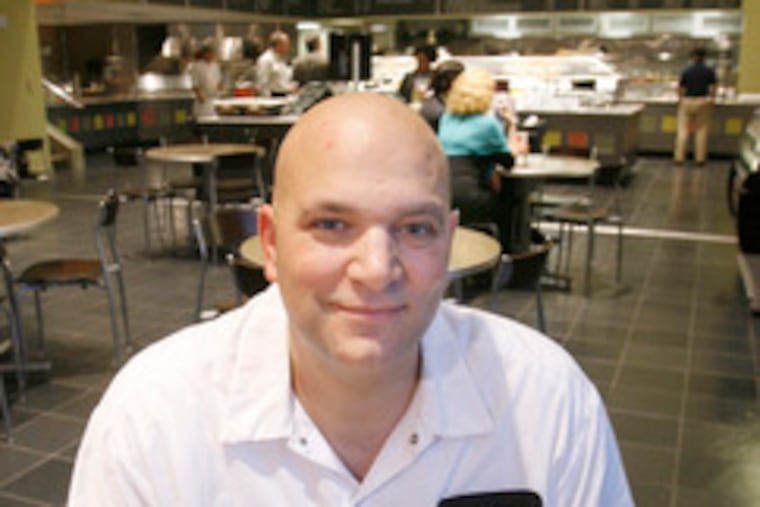 Matt Pagano, with a chicken cutlet sandwich, recently opened Pagano's Market at 2001 Market St.