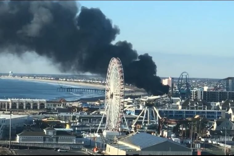 This still taken from a Facebook Live video by Ocean City, N.J., resident George Flowers shows smoke billowing from the Ocean City boardwalk Saturday morning.