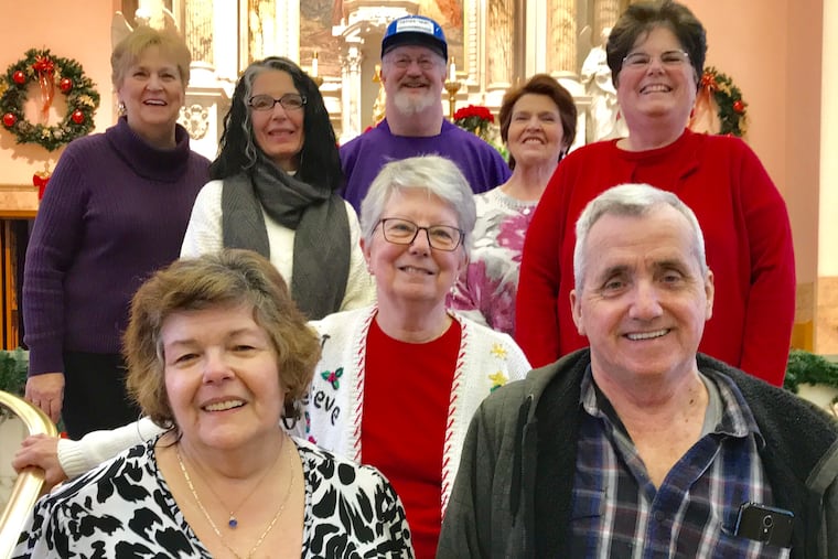 St. Anne's pastor, Father Skip Miller (back row, in hat), with parish members who spearheaded the campaign to install a new elevator.