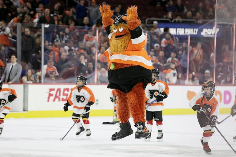 Flyers mascot Gritty celebrates his goal in between periods during the Arizona Coyotes vs. Philadelphia Flyers NHL game at the Wells Fargo Center in Philadelphia on Nov. 8. ELIZABETH ROBERTSON / Staff Photographer