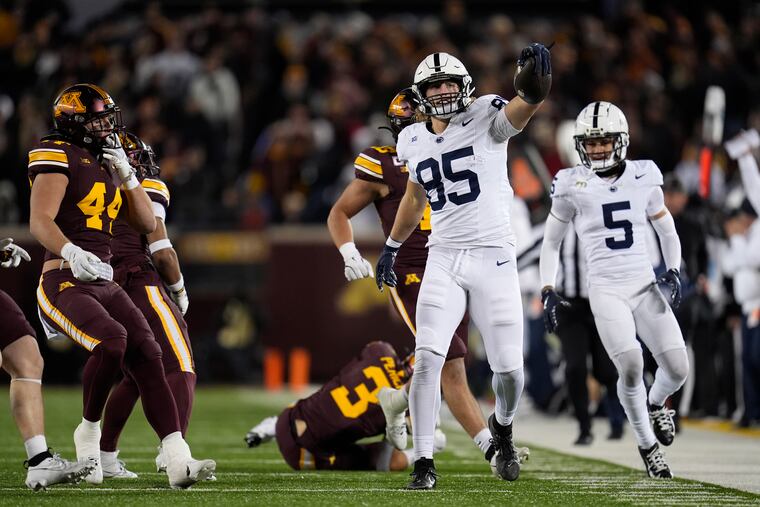 Penn State tight end Luke Reynolds (85) celebrates after running for a first down off a fake punt during the Nittany Lions' road win over Minnesota on Saturday.