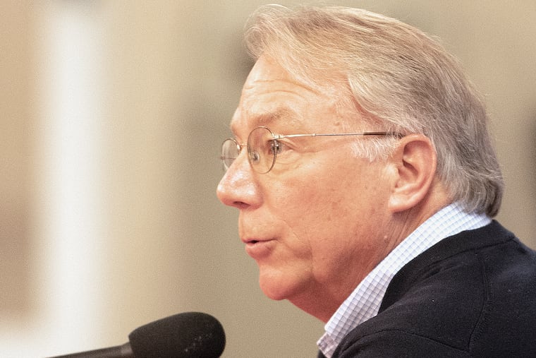 Phillies President Andy MacPhail talks to reporters after Friday's spring-training workout in Clearwatter, Fla.